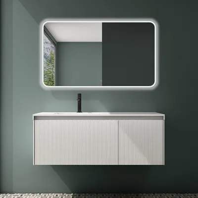 A modern bathroom vanity with a sink and faucet, set against a teal wall.