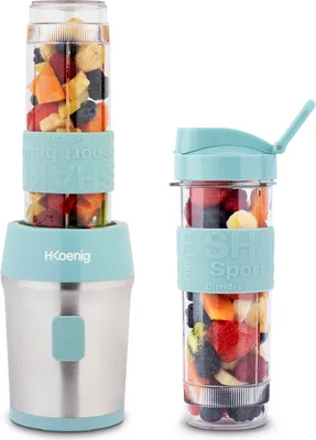 Two portable smoothie makers filled with fruit, one assembled and one with a lid.