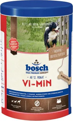 A product shot of dog food packaging with a dog in the background.