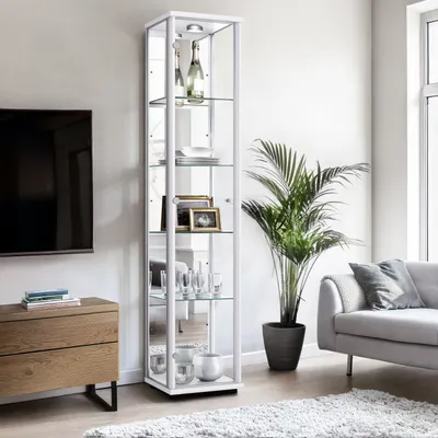 A modern living room with a display cabinet, sofa, and plant.