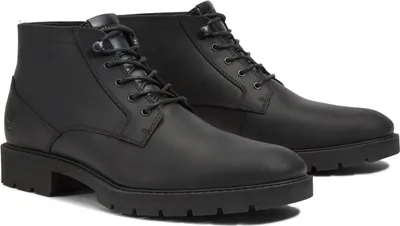 A pair of black leather chukka boots.