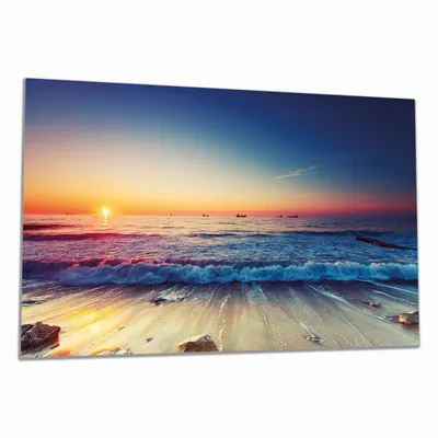Produktbild von Wallario Herdabdeckplatte aus Glas, Größe 90 x 52 cm 1-teilig, Motiv Sonnenuntergang am Meer mit Wellen am Strand