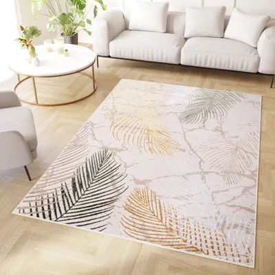 A living room scene with a sofa, armchair, coffee table, and a rug.