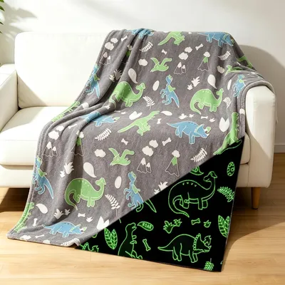 Imagen del producto de Manta suave con motivos de dinosaurios, que brilla en la oscuridad, de 100x150 cm, ideal para la habitación infantil