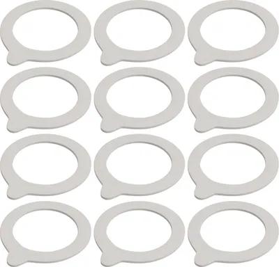 A grid of twelve white canning jar rings with a small tab on each.