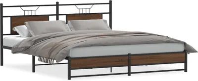 A bed frame with a headboard and footboard, made of metal and wood-effect panels, with bedding on top.