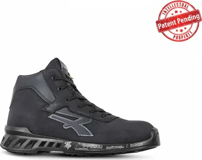 A black work boot is shown against a white background. A red circular stamp with text is in the upper right corner.