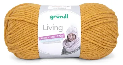 A ball of yellow yarn with a label showing a person wearing a scarf and hat.