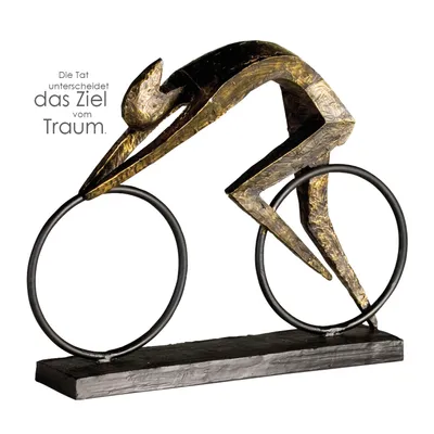 A sculpture of a cyclist in a racing pose.