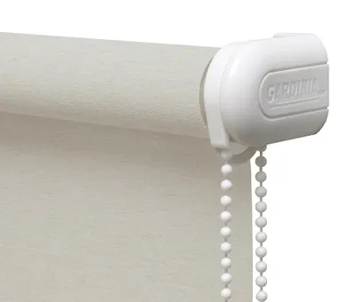 Close-up of a roller blind mechanism and fabric.