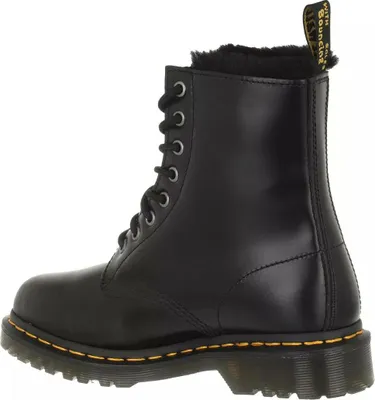 A side view of a black Dr. Martens boot.