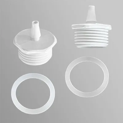 Two white plastic caps with threaded bases and conical spouts, and two white plastic rings, are arranged on a light gray background.