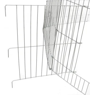 A close-up view of a metal wire fence, likely part of an animal enclosure.