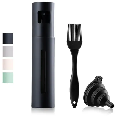 A black oil sprayer bottle with a brush and a funnel on a white background.