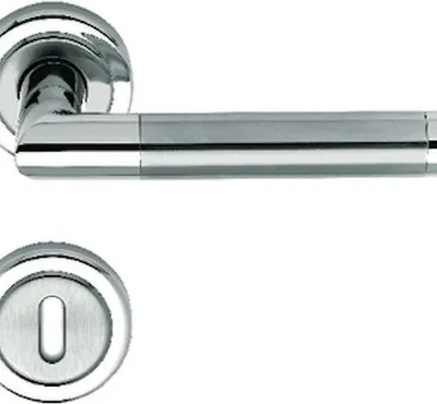 A close-up studio shot of a door handle set and a keyhole escutcheon.