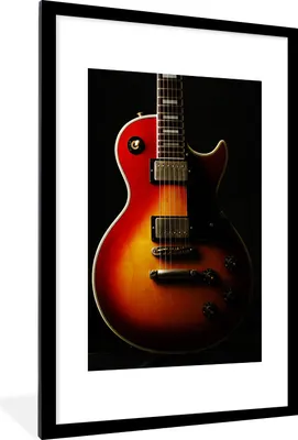 Produktbild von MuchoWow® Gerahmtes Poster Eine rot gefärbte E-Gitarre 60x90 cm - Poster mit Schwarzem Bilderrahmen Wandposter Rahmen Foto Bilder - Dekoration - Wandposter Wohnzimmer - Hochwertig