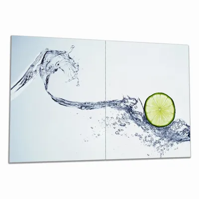 Produktbild von Wallario Herdabdeckplatte aus Glas, Größe 80 x 52 cm 2-teilig, Motiv Limettenscheibe in spritzigem Wasser