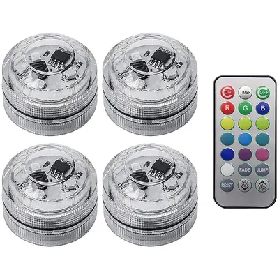 Four submersible LED lights and a remote control are displayed on a white background.