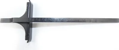 A black parallel guide for a circular saw is shown against a white background.