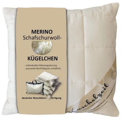 A pillow with a product label attached.