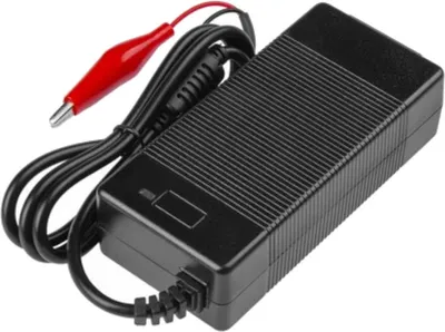 A black battery charger with red and black alligator clips attached to a black cable.