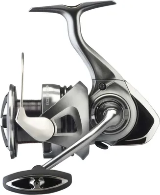 A studio shot of a fishing reel against a white background.