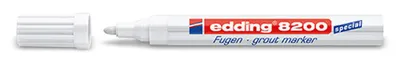 A white grout marker with its cap off, lying on a white background.