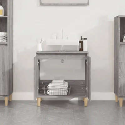 A bathroom vanity with a sink and open cabinet doors showing towels inside. Another tall cabinet is visible on the left and right.