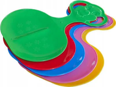 A stack of colorful plastic sleds on a white background.