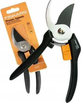 A Fiskars bypass pruner is shown in its packaging, with a second pruner displayed outside the packaging.