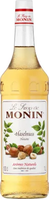 A bottle of Monin Hazelnut syrup.