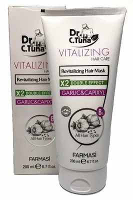 A product shot of a hair mask tube and its packaging.