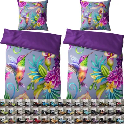 A bedding set with a hummingbird and floral pattern, displayed with a solid purple border.