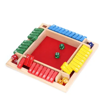A wooden board game with colorful numbered tiles and dice on a red felt surface.