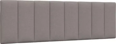 A headboard with vertical stitching.