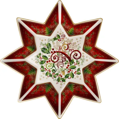 A star-shaped serving dish with a Christmas-themed design.