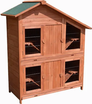 A wooden multi-level rabbit hutch with a green roof, shown against a white background.