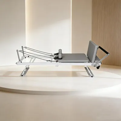 Produktbild von Pilates Reformer - Klappbarer Heimtrainer - Verstellbarer Federwiderstand - Mit Pedal - Max. Belastung 250 kg - Stahlrahmen - Beige