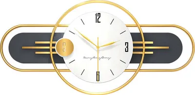 A modern wall clock with a gold frame and a white face, featuring gold hands and black hour markers. The clock has a decorative dark gray element with gold horizontal lines.