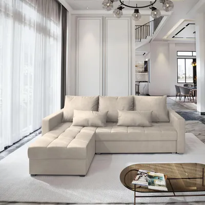 A modern living room with a cream-colored sectional sofa.