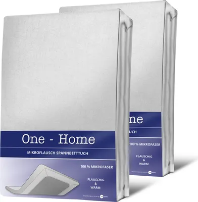 Two white packaged bed sheets are shown against a white and light gray background.