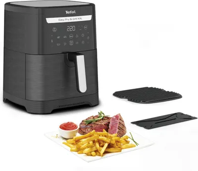 A Tefal Easy Fry & Grill XXL air fryer is shown with accessories and a plate of food.