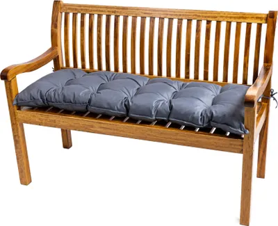 A gray cushion on a wooden garden bench.