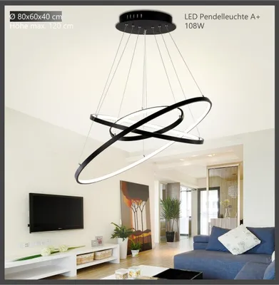 A modern living room with a large LED pendant light hanging from the ceiling.