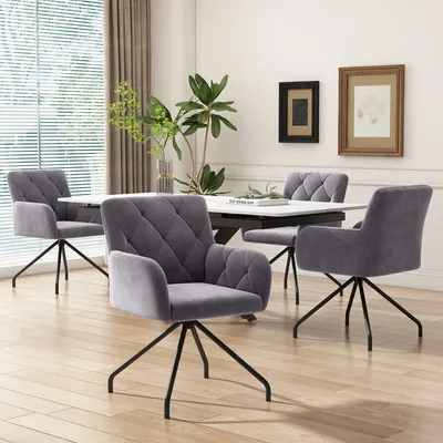 A dining room setting with four chairs around a table.