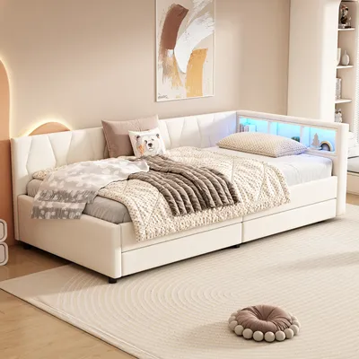 A bedroom scene with a daybed, pillows, and blankets.