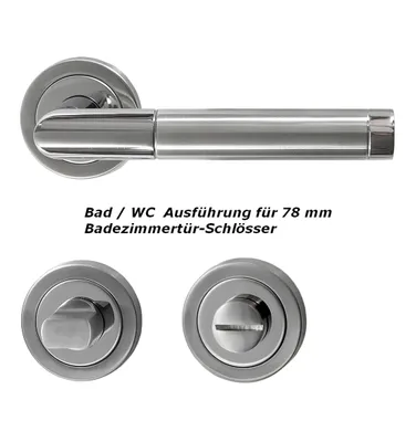 A set of stainless steel door handles and related hardware for a bathroom or WC door.