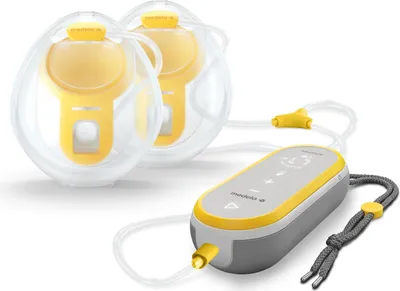 A double breast pump system with a control unit and two breast shields, displayed on a white background.