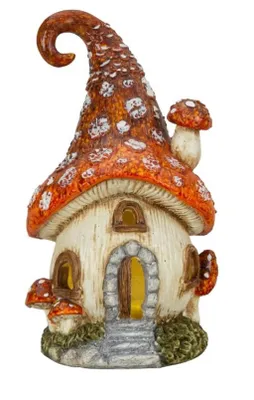 Haus hat organische, abgerundete Form, die an Pilz erinnert. Hut ist spitz zulaufend mit Spitze.