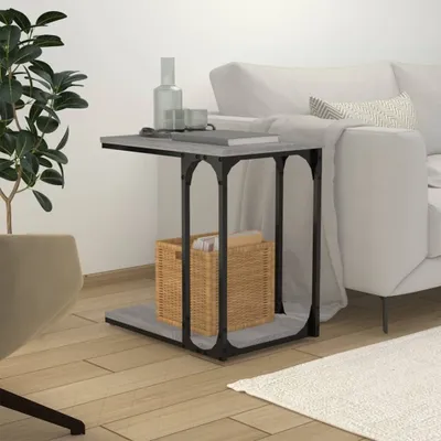 A side table next to a sofa in a living room.